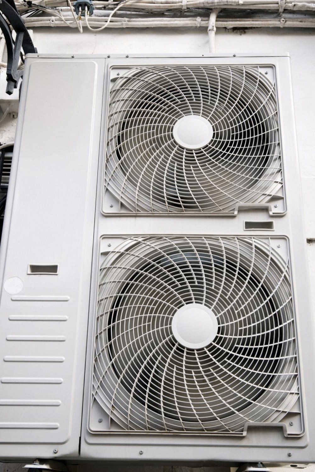 Close-up of a portable twin-fan cooling unit used to keep workers cool on a UAE construction site