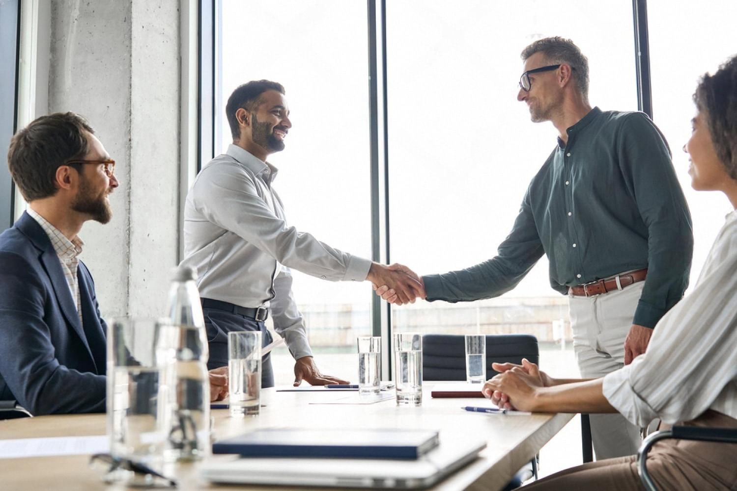 UAE business partners shaking hands after finalising a succession agreement